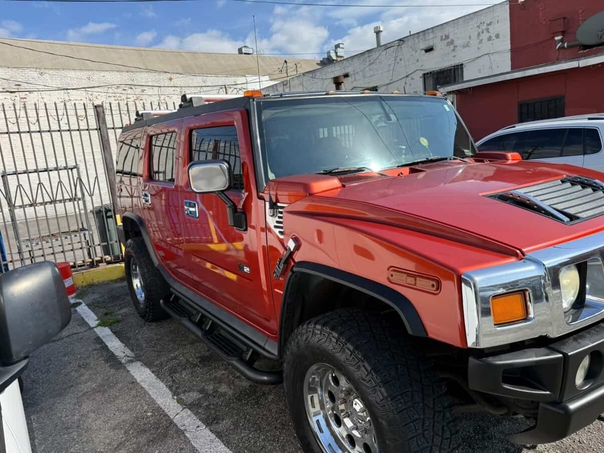 Bright orange Hummer H2 detailed by 213 Luis Mobile Detailing